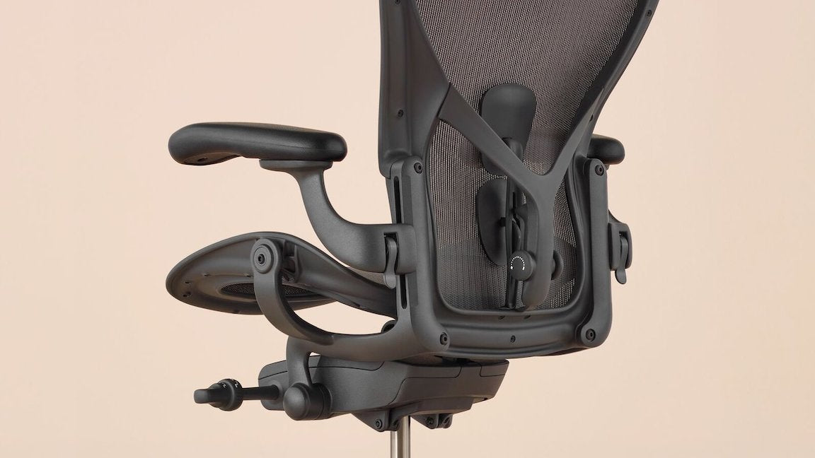 Herman Miller Aeron Remastered in Graphite, fully loaded with posture fit and adjustable armrests. Size A, Size B, Size C available in Melbourne.